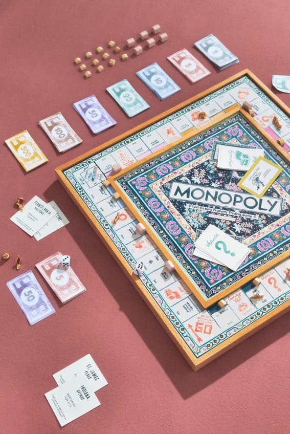 A beautifully designed Monopoly board game spread out on a table.