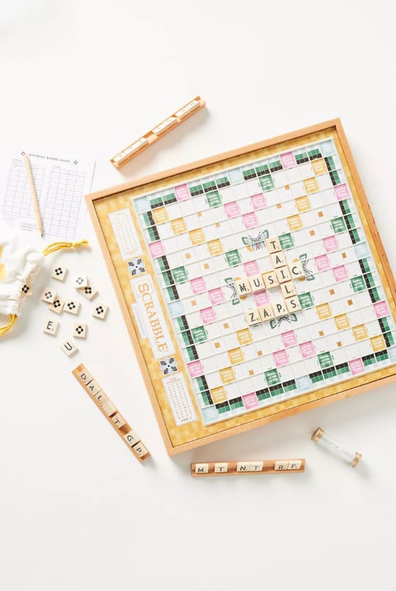 A designer Scrabble game with wooden tiles and racks.