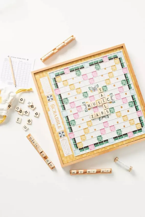 A designer Scrabble game with wooden tiles and racks.