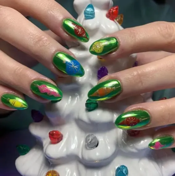 Green nails with intricate Christmas designs.