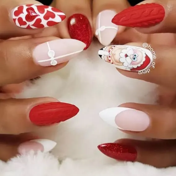 Short nails featuring hearts, Santa design, and glitter texture