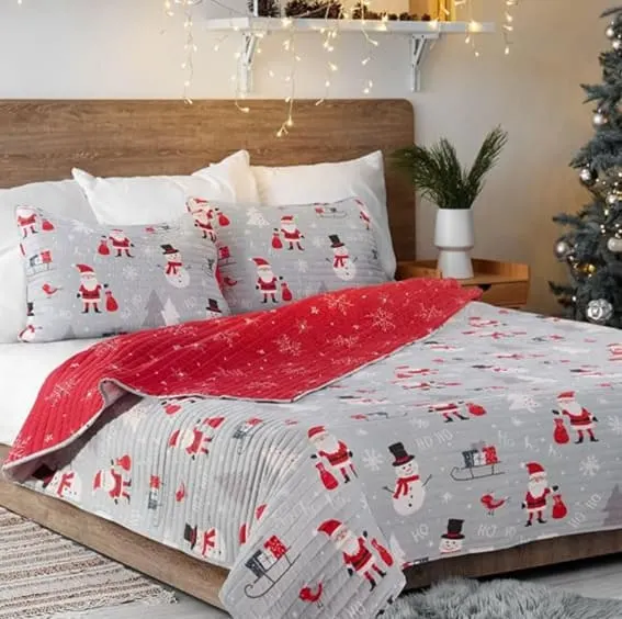 A queen quilt set with fun Santa and snowman designs.