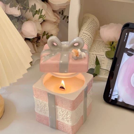 A candle shaped like a whimsical present.