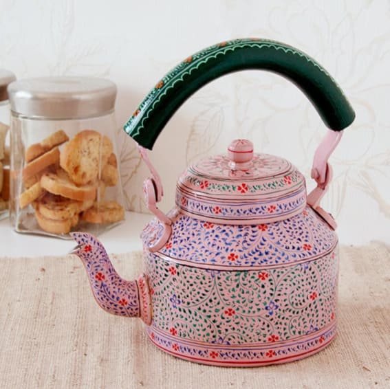 Artisanal teapot with intricate patterns, perfect for after-dinner tea.