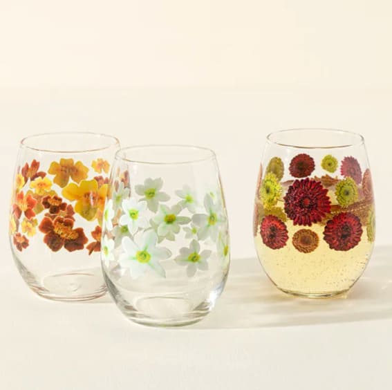 Stemless wine glasses with birth month flower illustrations, a chic Christmas gift idea.