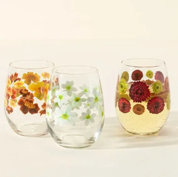 Stemless wine glasses with birth month flower illustrations, a chic Christmas gift idea.