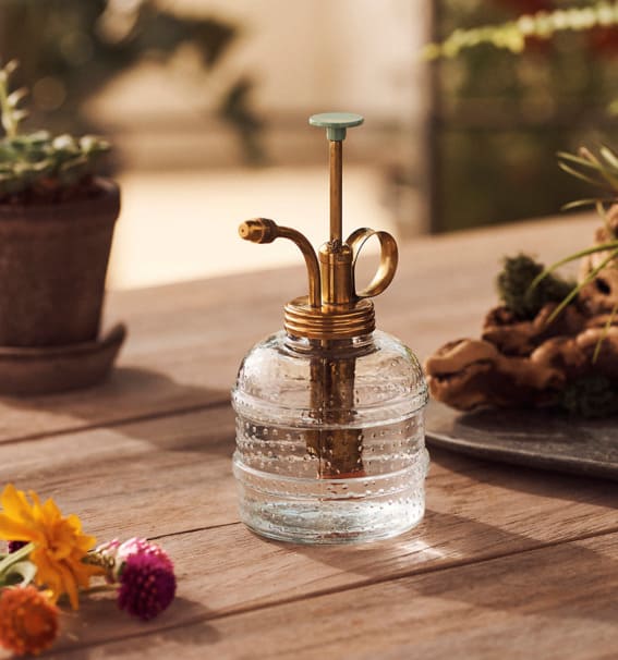 A vintage-inspired glass mister for a refined touch to plant care.