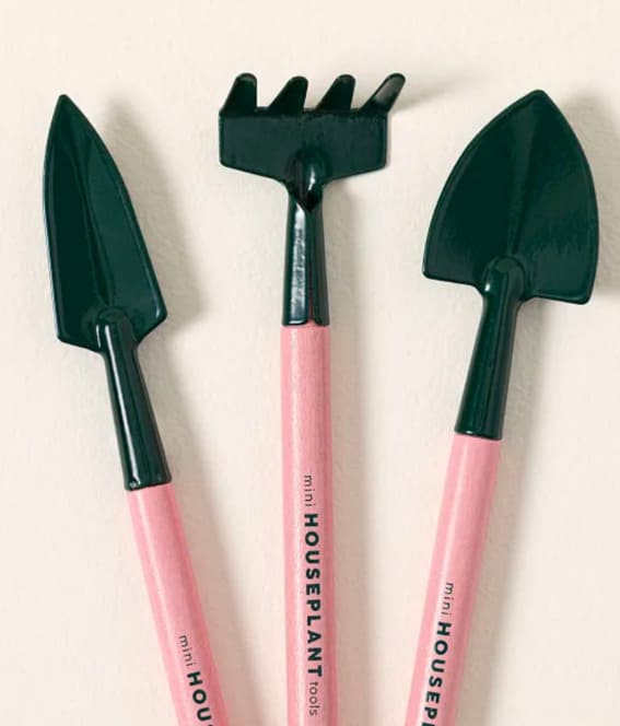 A chic, pink gardening tool set complete with durable gloves.
