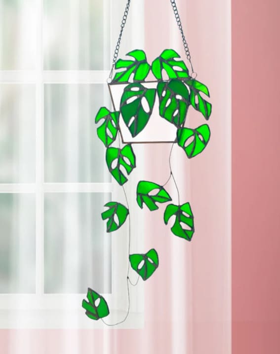 A captivating Monstera-inspired stained glass piece that brings the outdoors inside.