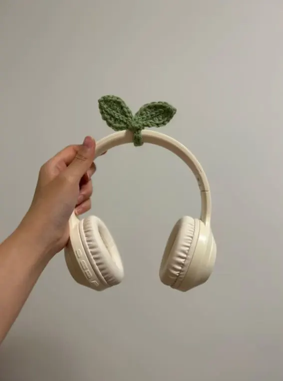 A whimsically crafted crochet leaf to adorn and greenify your headphones.