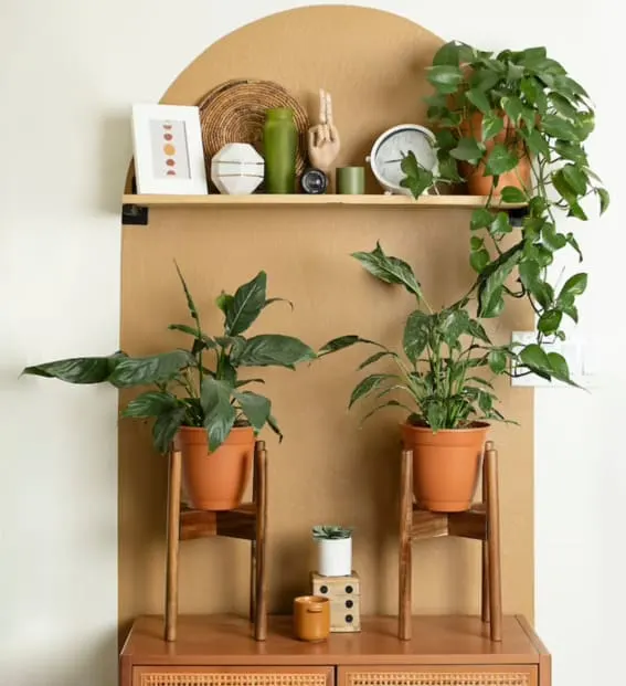 A chic plant stand showcasing potted greenery in a stylish interior.