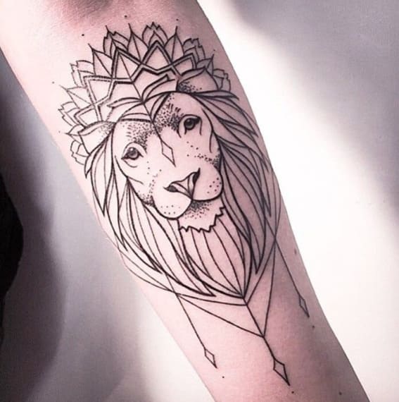 A geometric lion tattoo on the forearm