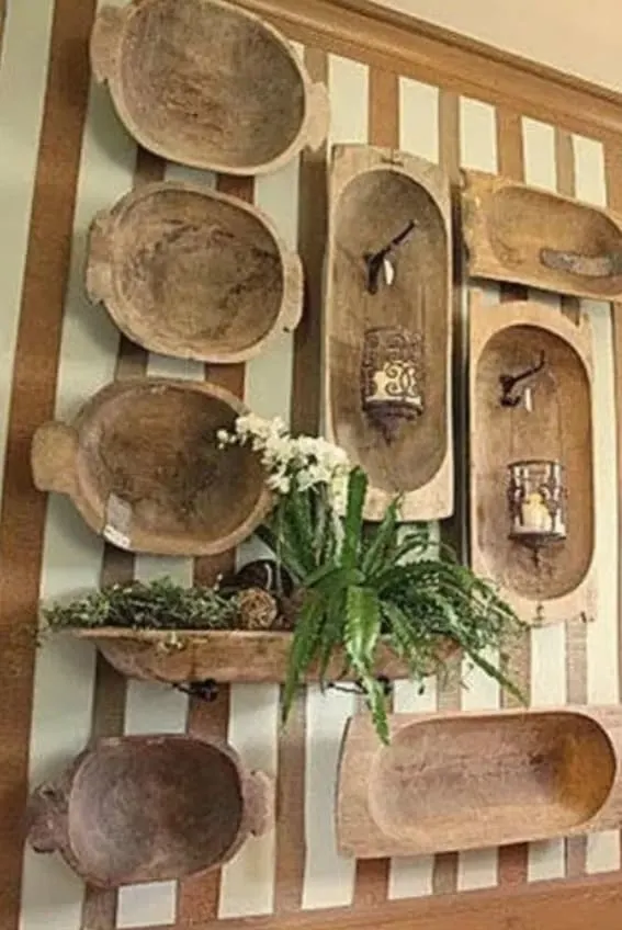 Wall display featuring a collection of antique dough bowls
