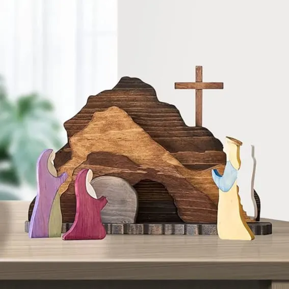 Wooden Easter Resurrection scene with figures and a cross.