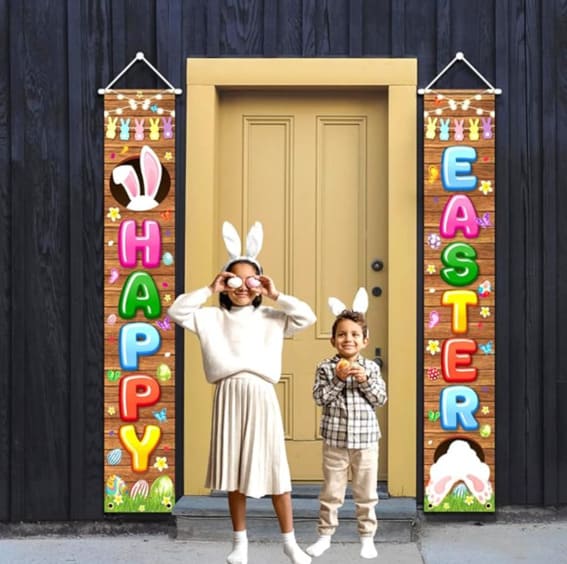 Colorful 'Happy Easter' vertical porch sign flanked by two children wearing bunny ears.
