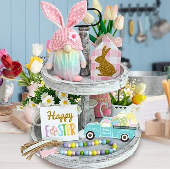Easter-themed tiered tray decor with gnomes and festive accents.