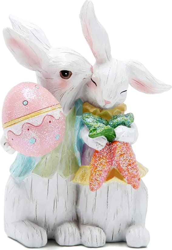 Easter Bunny couple figurines with a sparkling egg, tabletop decor.