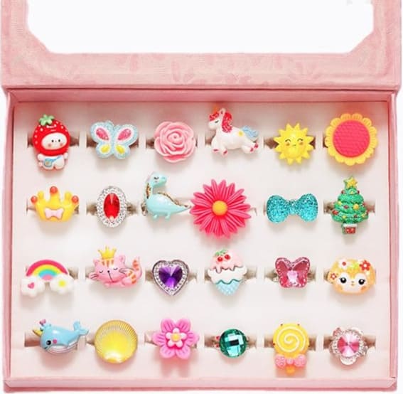 Assorted PinkSheep jewel rings in a box, colorful designs for little girls.