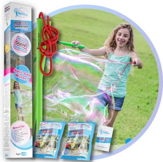A child creating huge bubbles with the Giant Bubble Wands Kit outdoors.