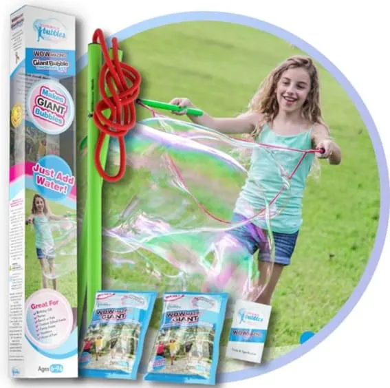 A child creating huge bubbles with the Giant Bubble Wands Kit outdoors.