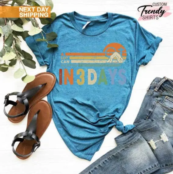 He is Risen shirt displayed with sandals and jeans