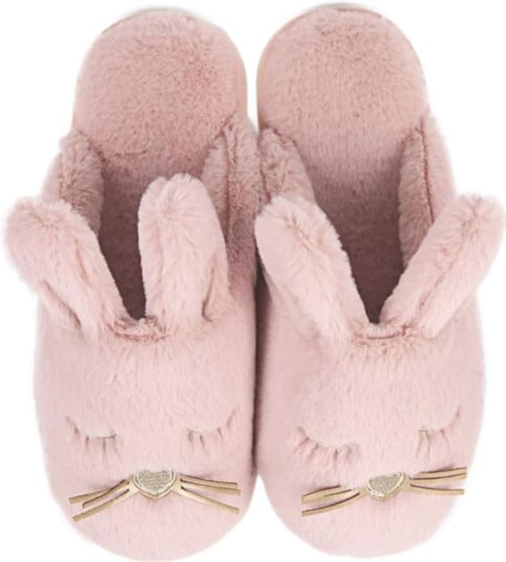 Plush pink bunny slippers with heart-shaped nose and decorative bow detail.
