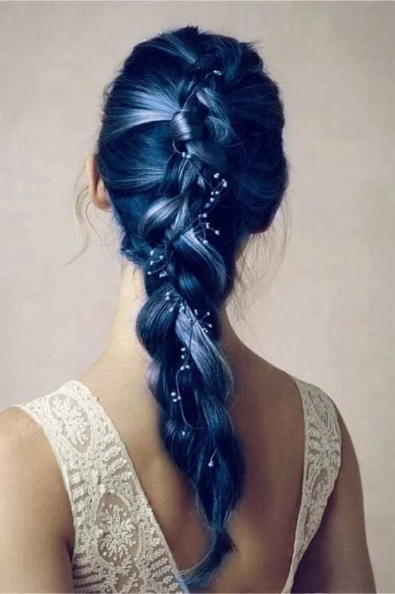 An intricate braid crafted with sapphire blue strands and delicate embellishments to evoke the night sky.