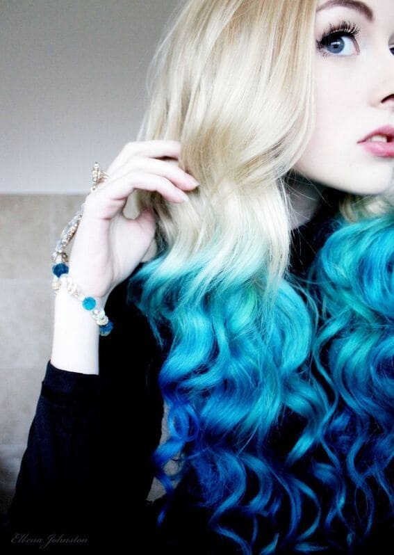 Half blonde and half blue curls cascading down.