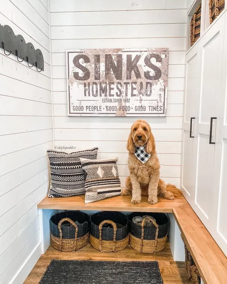 Photo by @seasonsofmyhome on Instagram. This wooden bench along with the dog, makes this mudroom so inviting! 