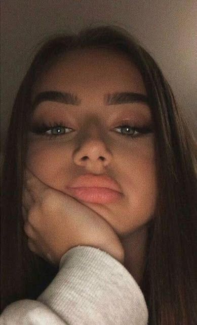 Close-up of a woman with soft glam makeup