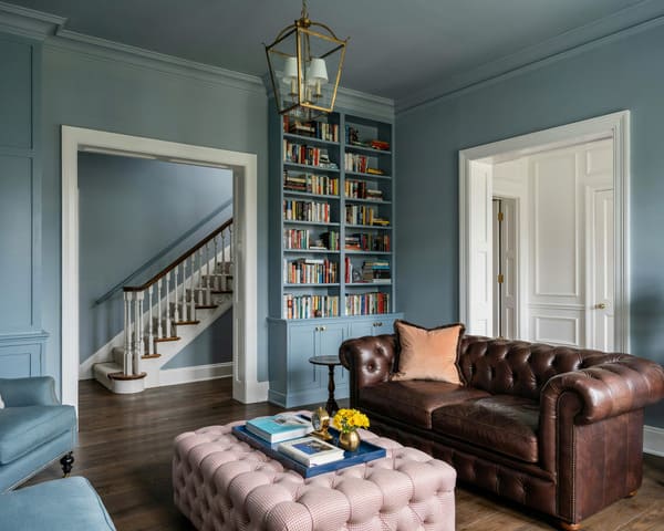 Living room with an area rug and upholstered furniture.