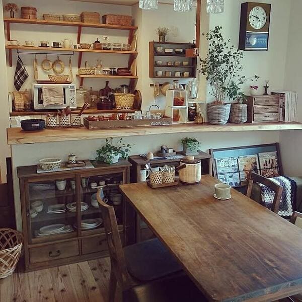 Cozy kitchen with open shelves packed with dishes and decorative items