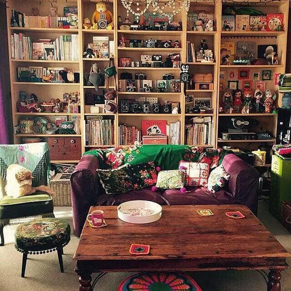 Maximalist living room filled with collections furniture and decorative items