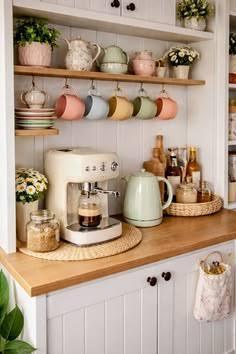 Small kitchen coffee bar with mug rail, open shelving and countertop appliances